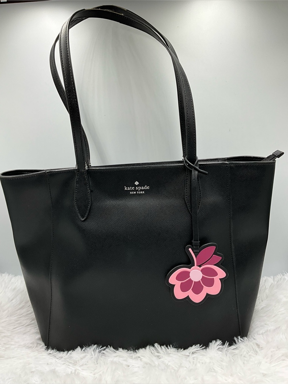 kate spade New York Black Leather Tote with Pink Floral Charm